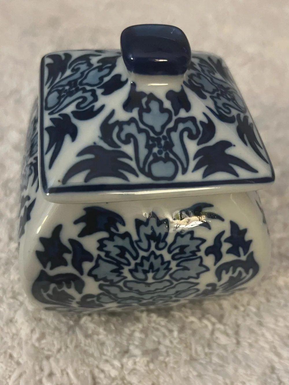 Vintage porcelain lidded blue and white floral jar